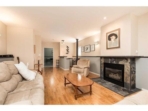 30 Heritage Crescent West, Lethbridge, AB - Indoor Photo Showing Living Room With Fireplace