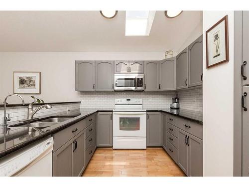 30 Heritage Crescent West, Lethbridge, AB - Indoor Photo Showing Kitchen With Double Sink