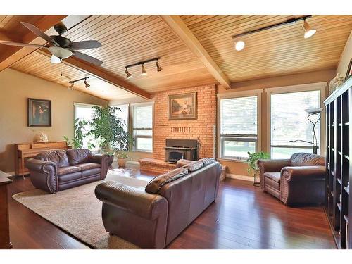 122 1 Avenue, Stirling, AB - Indoor Photo Showing Living Room With Fireplace