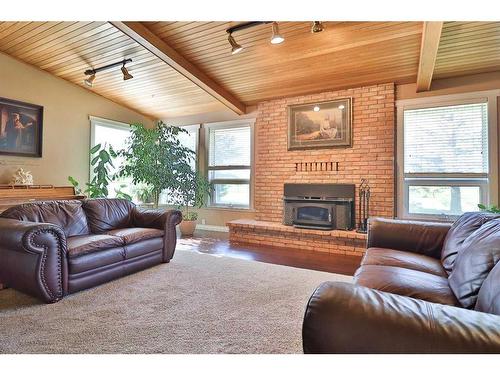 122 1 Avenue, Stirling, AB - Indoor Photo Showing Living Room With Fireplace