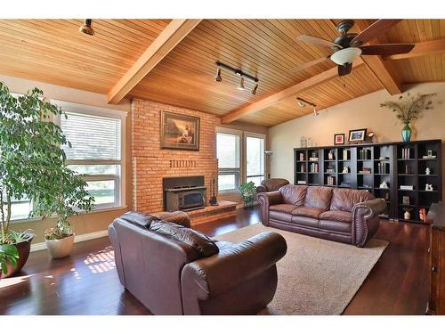 122 1 Avenue, Stirling, AB - Indoor Photo Showing Living Room With Fireplace