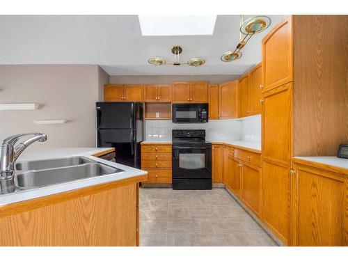 366 Fairmont Boulevard South, Lethbridge, AB - Indoor Photo Showing Kitchen With Double Sink