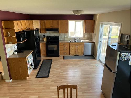 138 Peigan Court West, Lethbridge, AB - Indoor Photo Showing Kitchen With Double Sink