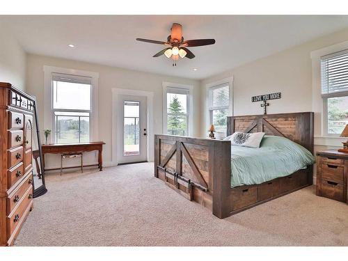 52 Cobblestone Lane, Raymond, AB - Indoor Photo Showing Bedroom