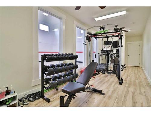 52 Cobblestone Lane, Raymond, AB - Indoor Photo Showing Gym Room