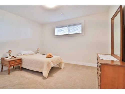 52 Cobblestone Lane, Raymond, AB - Indoor Photo Showing Bedroom