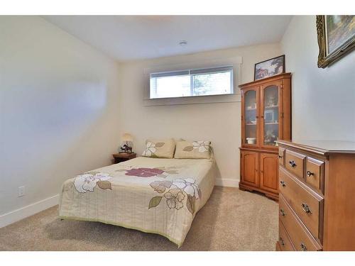 52 Cobblestone Lane, Raymond, AB - Indoor Photo Showing Bedroom