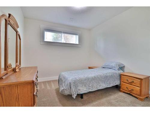 52 Cobblestone Lane, Raymond, AB - Indoor Photo Showing Bedroom