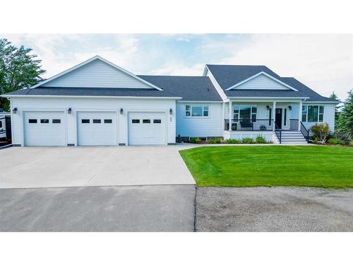 52 Cobblestone Lane, Raymond, AB - Outdoor With Deck Patio Veranda With Facade