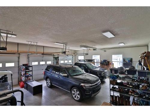 52 Cobblestone Lane, Raymond, AB - Indoor Photo Showing Garage