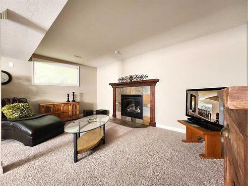 228 Southgate Boulevard South, Lethbridge, AB - Indoor Photo Showing Other Room With Fireplace