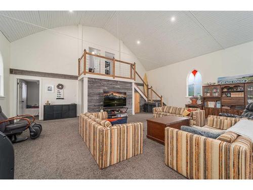 68 S 100 E, Raymond, AB - Indoor Photo Showing Living Room With Fireplace