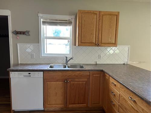 249 E 1 Avenue South, Magrath, AB - Indoor Photo Showing Kitchen With Double Sink