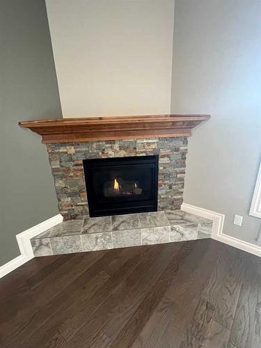 72 Sixmile Road South, Lethbridge, AB - Indoor Photo Showing Living Room With Fireplace