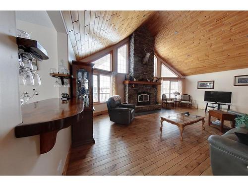 383066 And 383054 Range Road 7-3, Rural Clearwater County, AB - Indoor Photo Showing Living Room With Fireplace