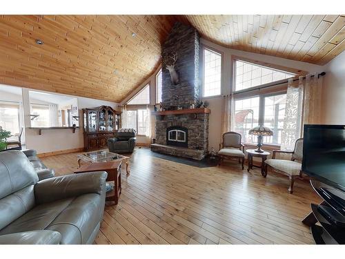 383066 And 383054 Range Road 7-3, Rural Clearwater County, AB - Indoor Photo Showing Living Room With Fireplace