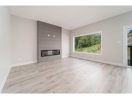 8601 24 Avenue, Coleman, AB - Indoor Photo Showing Living Room With Fireplace