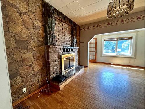 8202 15Th Avenue, Coleman, AB - Indoor Photo Showing Other Room With Fireplace