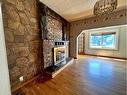 8202 15Th Avenue, Coleman, AB  - Indoor Photo Showing Other Room With Fireplace 