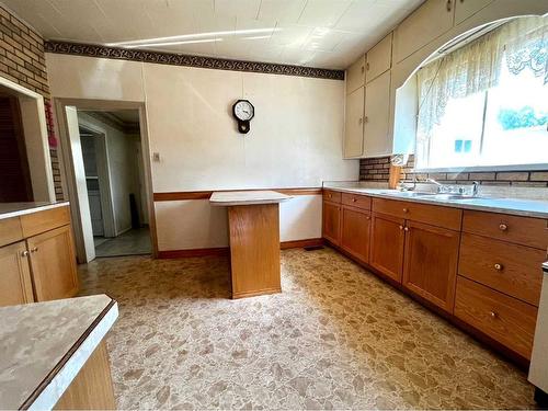 8202 15Th Avenue, Coleman, AB - Indoor Photo Showing Kitchen With Double Sink