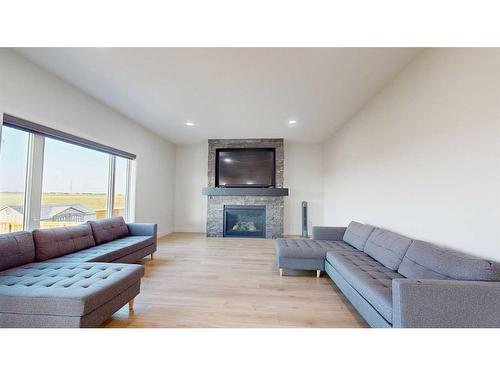 4725 40 Avenue S, Lethbridge, AB - Indoor Photo Showing Living Room With Fireplace