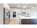 4725 40 Avenue S, Lethbridge, AB  - Indoor Photo Showing Kitchen With Stainless Steel Kitchen With Upgraded Kitchen 