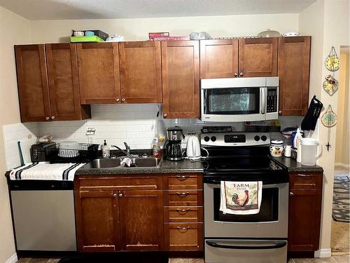 1423 13 Avenue South, Lethbridge, AB - Indoor Photo Showing Kitchen With Double Sink