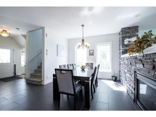 350 Twinriver Road West, Lethbridge, AB - Indoor Photo Showing Dining Room With Fireplace