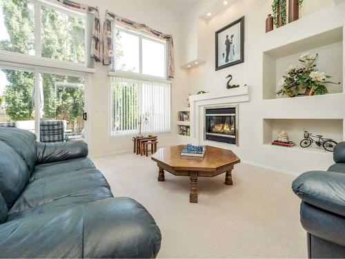 35 Fairmont Gate South, Lethbridge, AB - Indoor Photo Showing Living Room With Fireplace