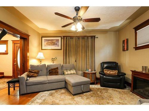 744 17 Street North, Lethbridge, AB - Indoor Photo Showing Living Room With Fireplace