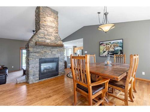 84053 Range Road 21-1, Rural Lethbridge County, AB - Indoor Photo Showing Dining Room With Fireplace