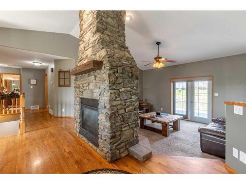 84053 Range Road 21-1, Rural Lethbridge County, AB - Indoor Photo Showing Living Room With Fireplace