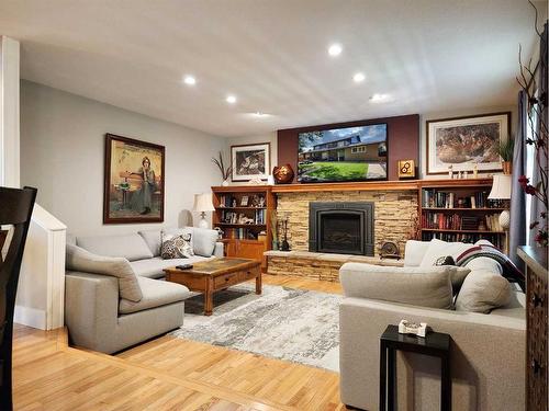 111 Tudor Crescent South, Lethbridge, AB - Indoor Photo Showing Living Room With Fireplace