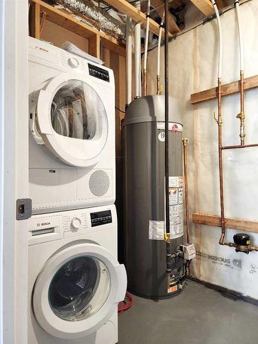 335 Aquitania Boulevard West, Lethbridge, AB - Indoor Photo Showing Laundry Room