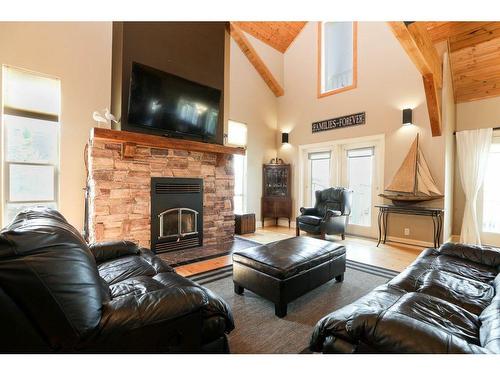 459 Sunset Drive, Rural Vulcan County, AB - Indoor Photo Showing Living Room With Fireplace