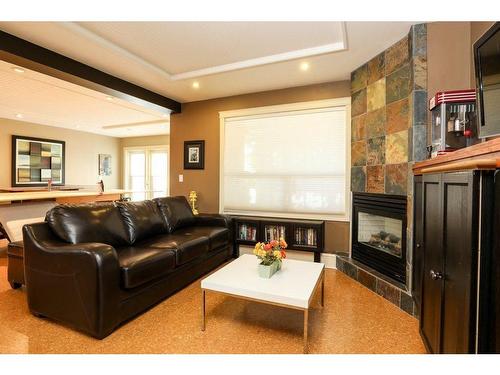 459 Sunset Drive, Rural Vulcan County, AB - Indoor Photo Showing Living Room With Fireplace