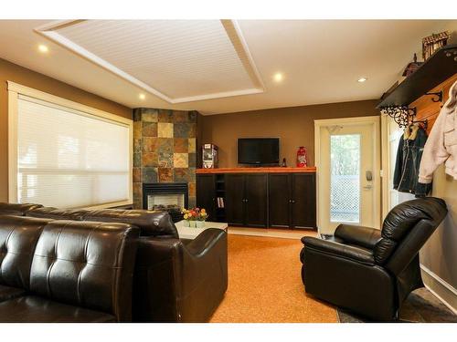 459 Sunset Drive, Rural Vulcan County, AB - Indoor Photo Showing Living Room With Fireplace