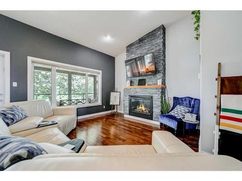 2804 23 Street, Coaldale, AB - Indoor Photo Showing Living Room With Fireplace