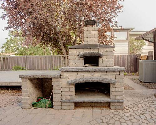 2005 16 Street North, Lethbridge, AB - Outdoor With Fireplace