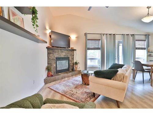 14 Edinburgh Gate West, Lethbridge, AB - Indoor Photo Showing Living Room With Fireplace