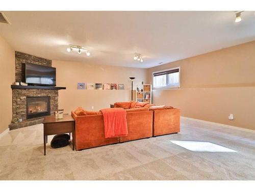 14 Edinburgh Gate West, Lethbridge, AB - Indoor Photo Showing Living Room With Fireplace