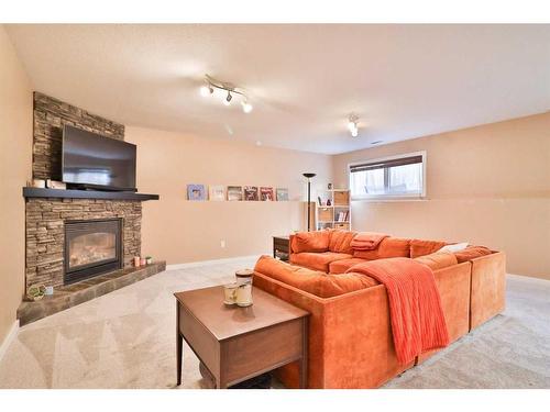 14 Edinburgh Gate West, Lethbridge, AB - Indoor Photo Showing Living Room With Fireplace