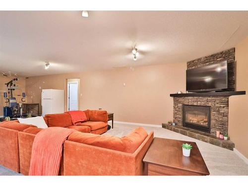 14 Edinburgh Gate West, Lethbridge, AB - Indoor Photo Showing Living Room With Fireplace