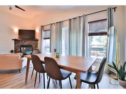 14 Edinburgh Gate West, Lethbridge, AB - Indoor Photo Showing Dining Room With Fireplace