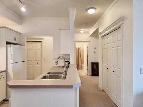 202-6 Skyline, Claresholm, AB - Indoor Photo Showing Kitchen With Double Sink