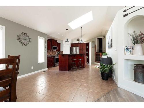 312 Thyrza Burkitt Link North, Lethbridge, AB - Indoor Photo Showing Dining Room With Fireplace