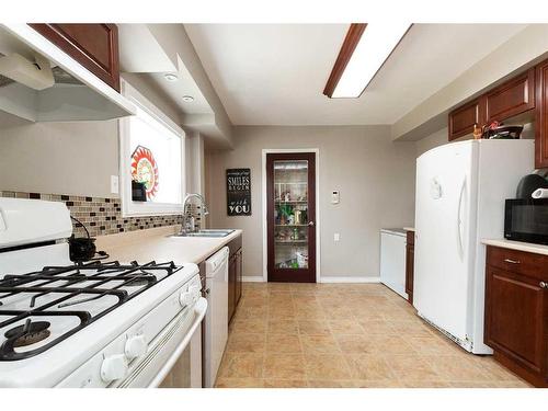 4936 50 Avenue, Stavely, AB - Indoor Photo Showing Kitchen With Double Sink