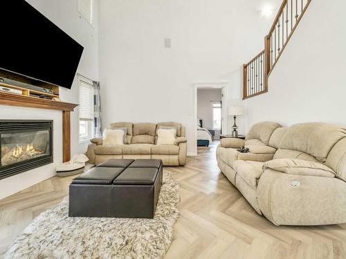 2812 23 Street, Coaldale, AB - Indoor Photo Showing Living Room With Fireplace