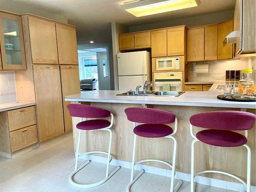 17 Bluefox Place North, Lethbridge, AB - Indoor Photo Showing Kitchen With Double Sink