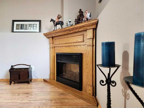 165 Heritage Crescent West, Lethbridge, AB - Indoor With Fireplace